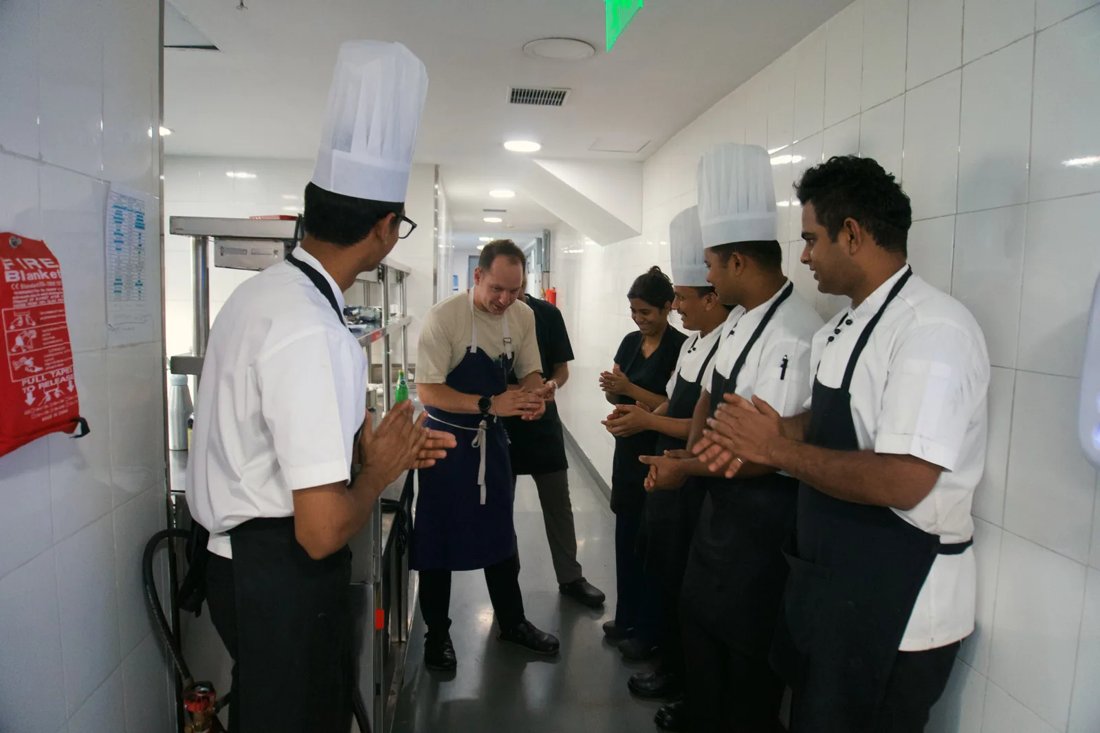 Jason discussing the menu with chefs in the Hyderabad kitchen