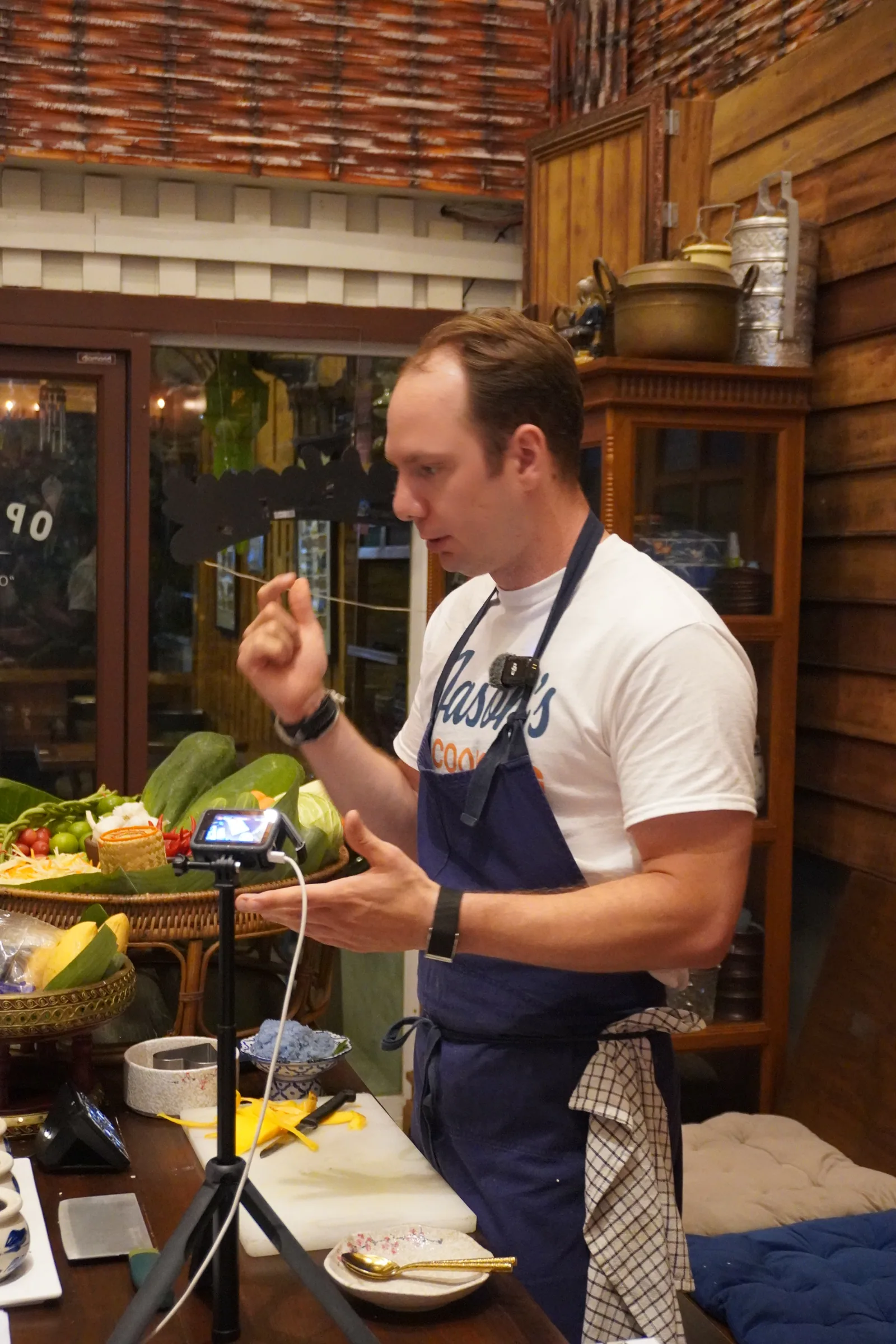 Jason tasting a bite during a cooking session in Thailand