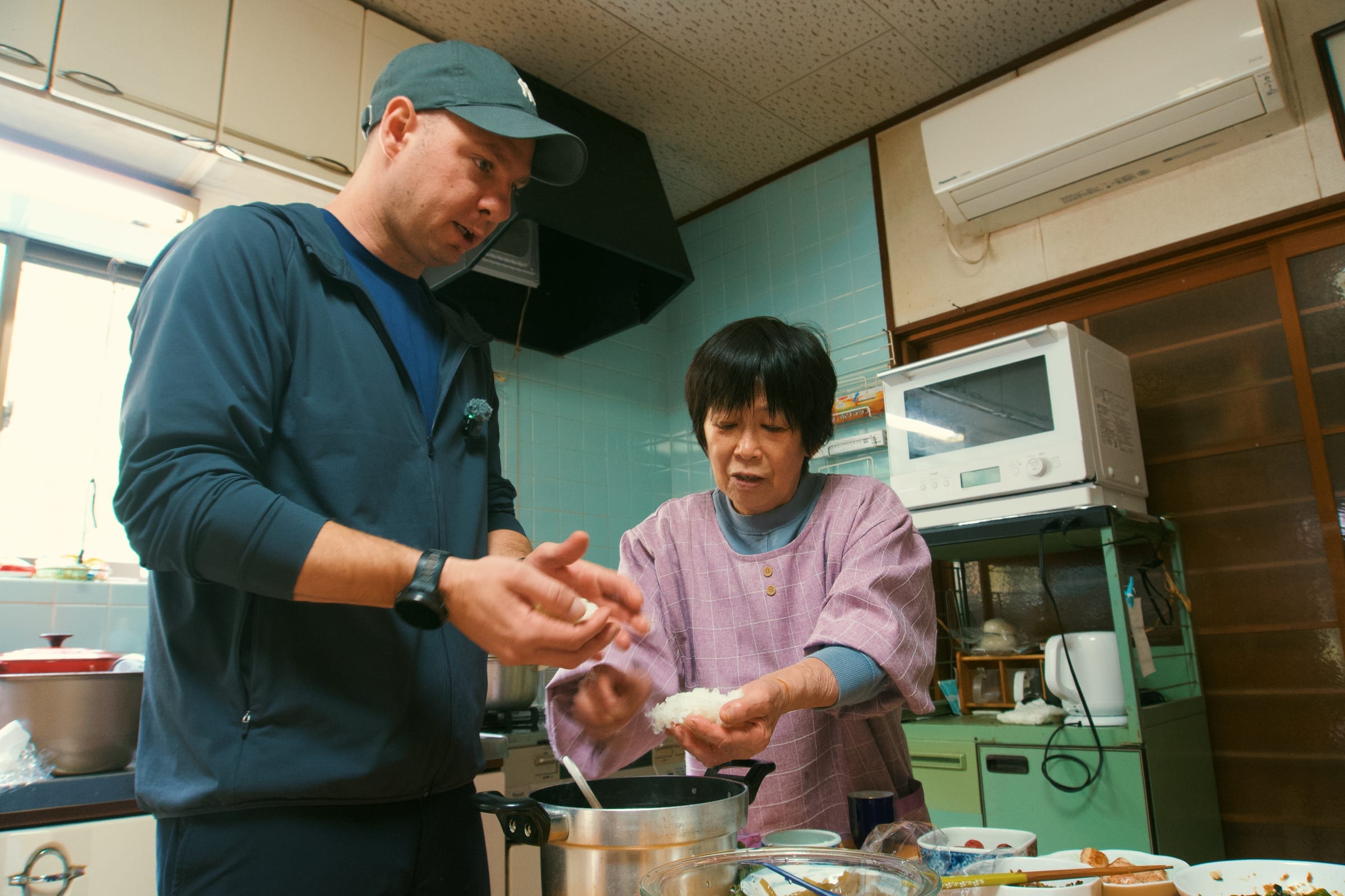 Jason making onigiri with Harita-san in Japan